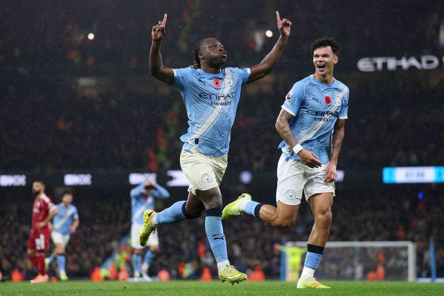 Jeremy Doku celebrates scoring Man City's third goal against Liverpool on Sunday Jeremy Doku celebrates scoring Man City's third goal against Liverpool on Sunday