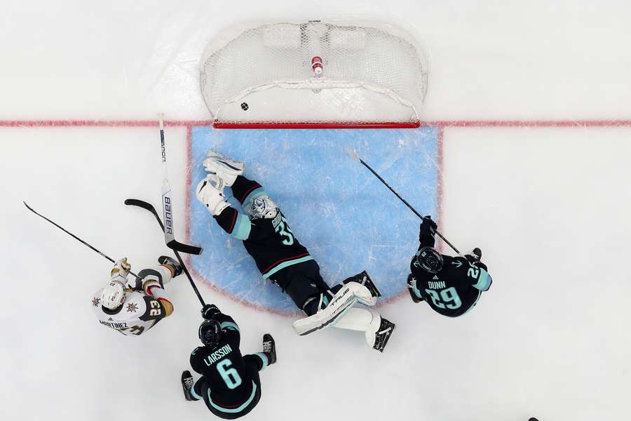 Alec Martinez #23 of the Vegas Golden Knights scores a goal during the second period against Philipp Grubauer #31 of the Seattle Kraken at Climate Pledge Arena on April 13, 2023