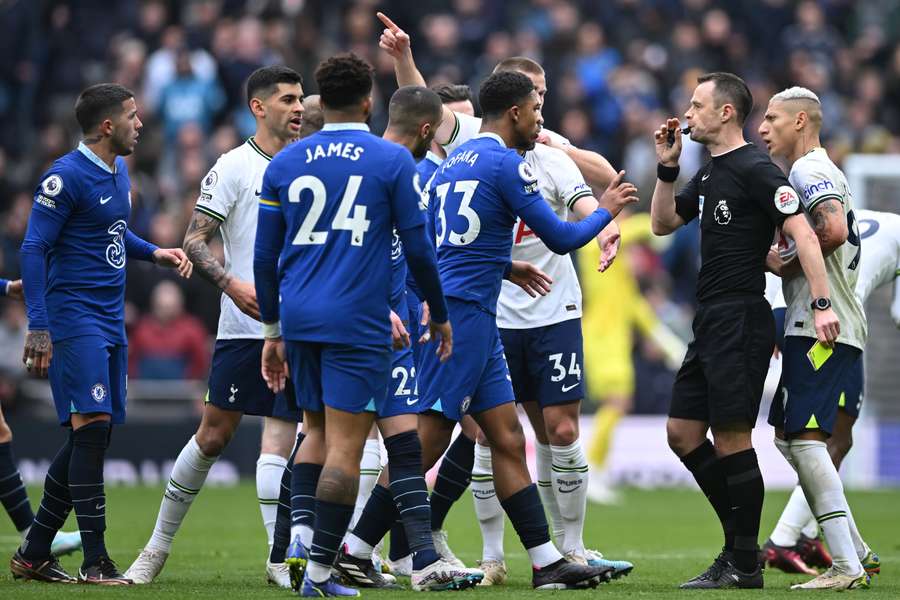 English referee Stuart Attwell (2R) blows his whistle as players clash 