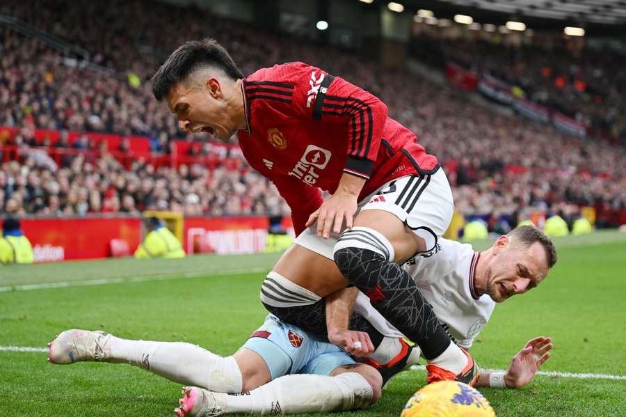 Lisandro Martinez of Manchester United injures his leg in this challenge with Vladimir Coufal