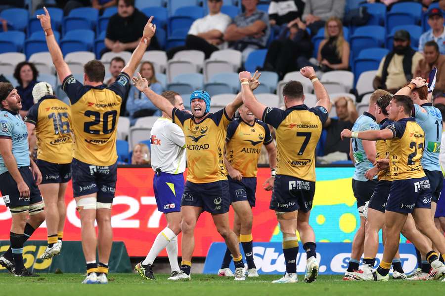 Western Force players celebrate their thrilling win over the Waratahs in Sydney. 