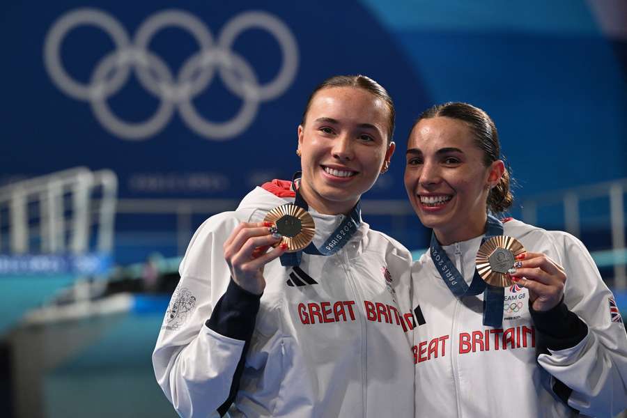 Bronze medallists Britain's Scarlett Mew Jensen and Yasmin Harper pose with their medals