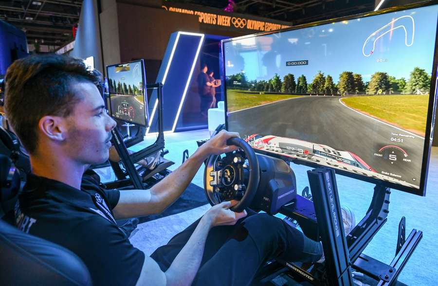 Esports player Kaj de Bruin tries out a race simulator before the start of the competition