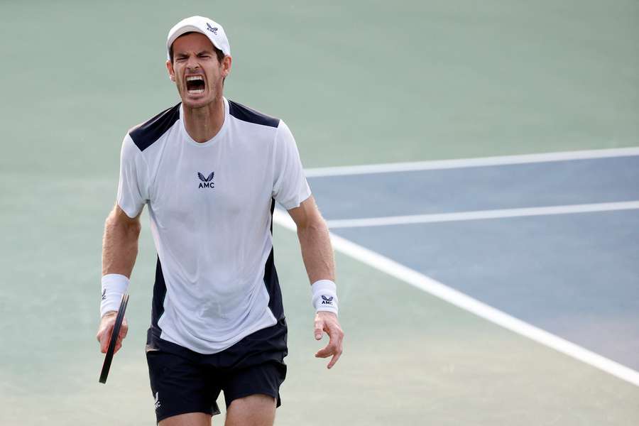 Andy Murray roars in delight after winning a point against Brandon Nakashima