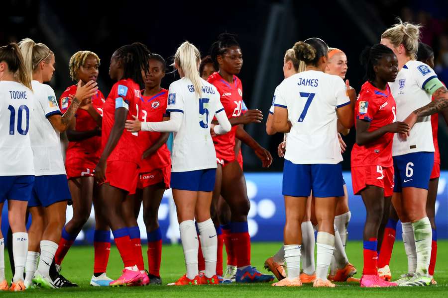 The players shake hands at full-time