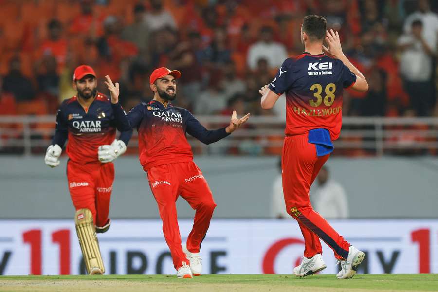 Josh Hazlewood celebrates with Virat Kohli during RCB's Qualifier win over Punjab Kings.