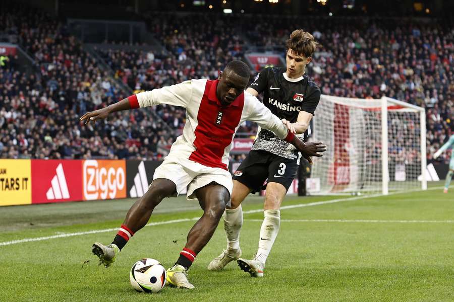Ajax's Brian Brobbey duelling with AZ defender Wouter Goes