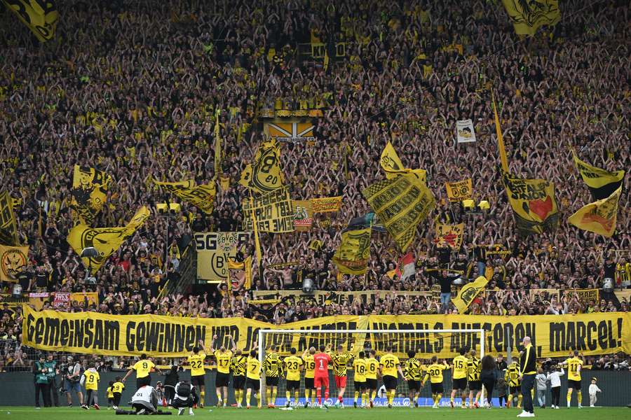 Dortmund's players take in support from their fans