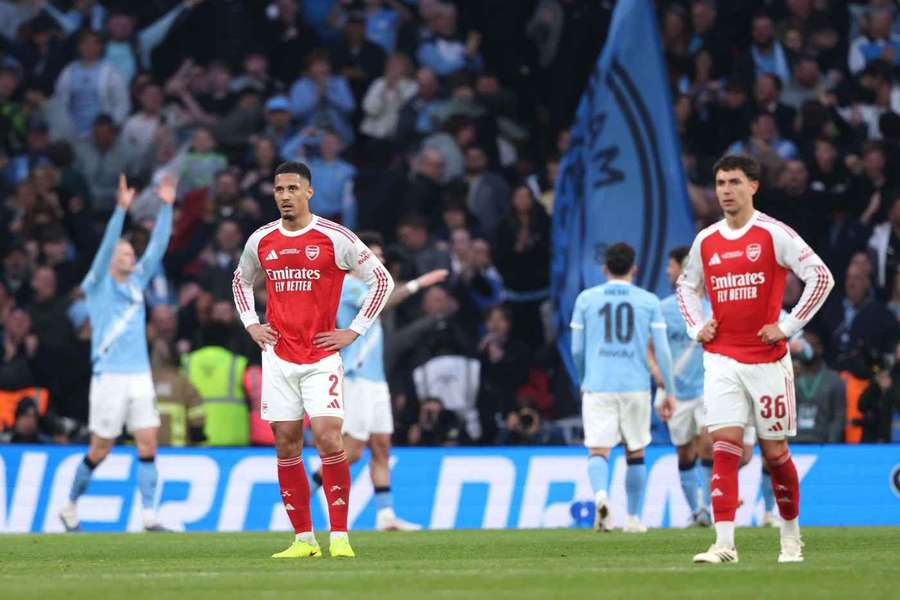 Man City celebrate winning the Carabao Cup final as Arsenal's players look dejected Man City celebrate winning the Carabao Cup final as Arsenal's players look dejected