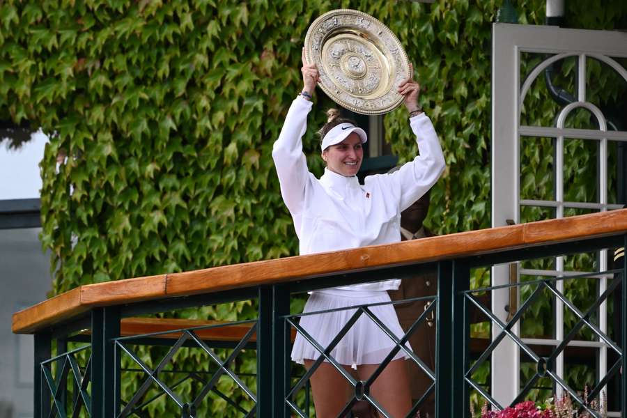 Czech Republic's Marketa Vondrousova celebrates with the Venus Rosewater Dish trophy