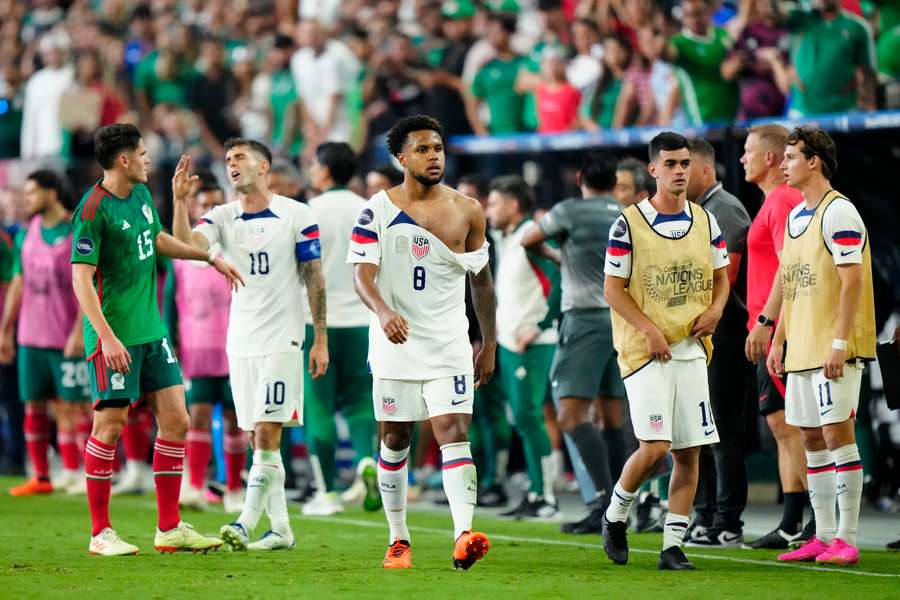 Weston Mckennie walks with a torn shirt following a scuffle against Mexico