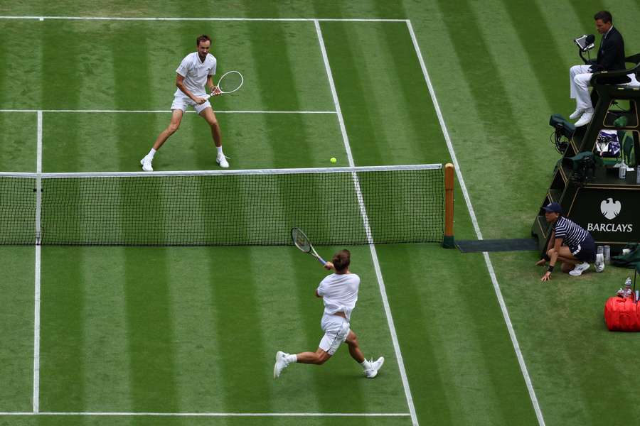 Britain's Arthur Fery (bottom) returns the ball to Russia's Daniil Medvedev