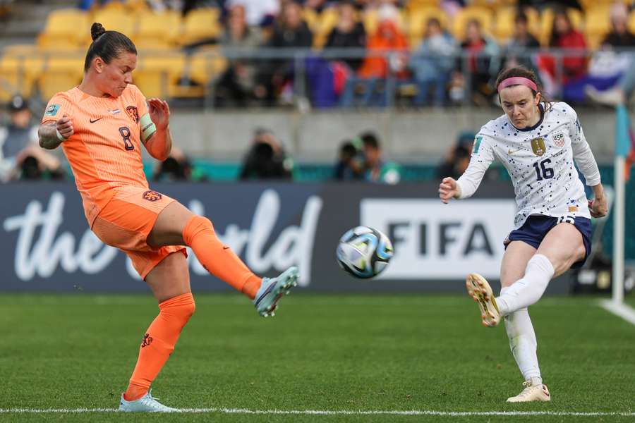 USA's midfielder #16 Rose Lavelle (R) shoots the ball USA's midfielder #16 Rose Lavelle (R) shoots the ball