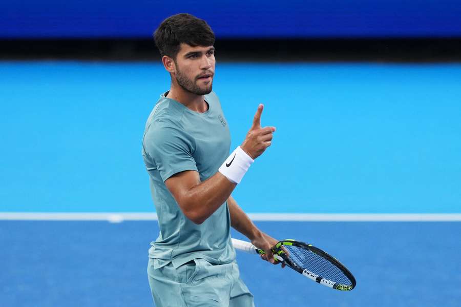 Carlos Alcaraz reacts after winning a point against Alexander Zverev Carlos Alcaraz reacts after winning a point against Alexander Zverev
