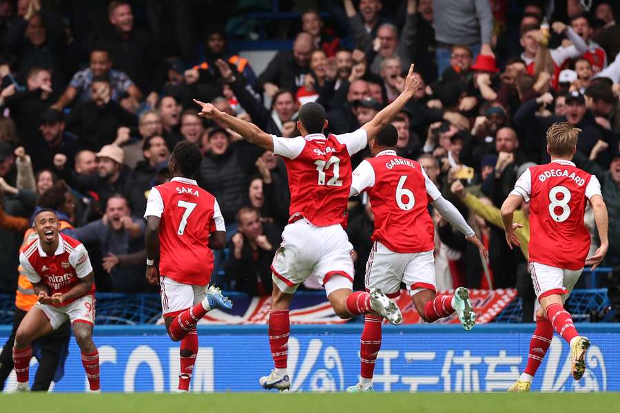 Arsenal celebrate the winner in front of their travelling fans 