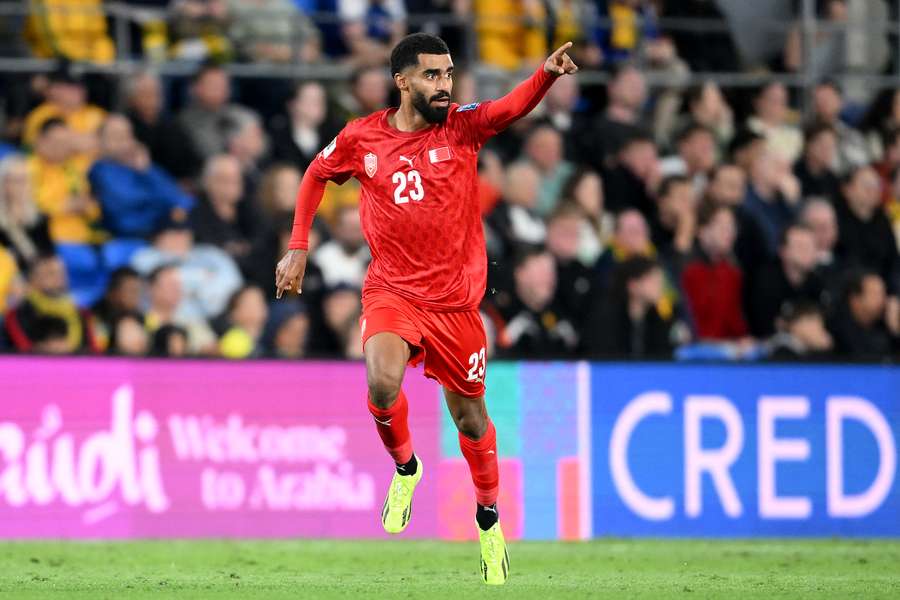 Abdulla Al-Khalasi of Bahrain celebrates after his side score