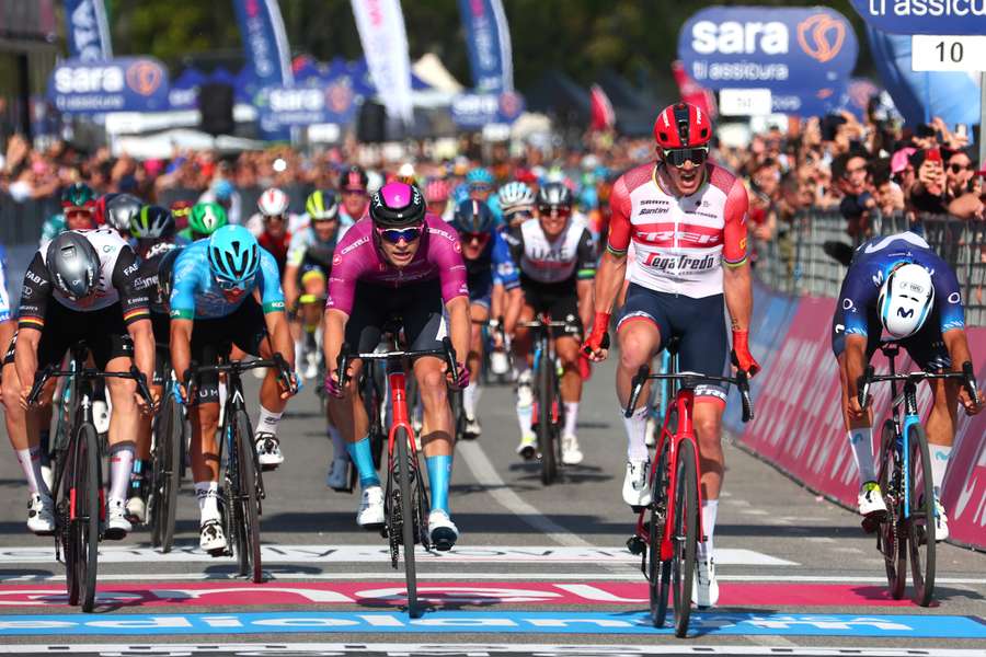 Segafredo rider Mads Pedersen (second right) sprints ahead of Bahrain-Victorious rider Jonathan Milan (centre) and UAE Team Emirates rider Pascal Ackermann (left) to the finish line