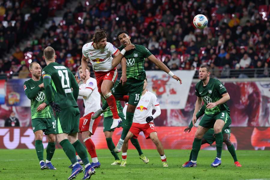 RB Leipzig's Willi Orban and Wolfsburg's Moritz Jenz vie for the ball RB Leipzig's Willi Orban and Wolfsburg's Moritz Jenz vie for the ball