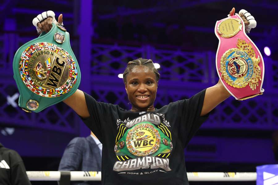 Dubois raises her belts after beating Harper