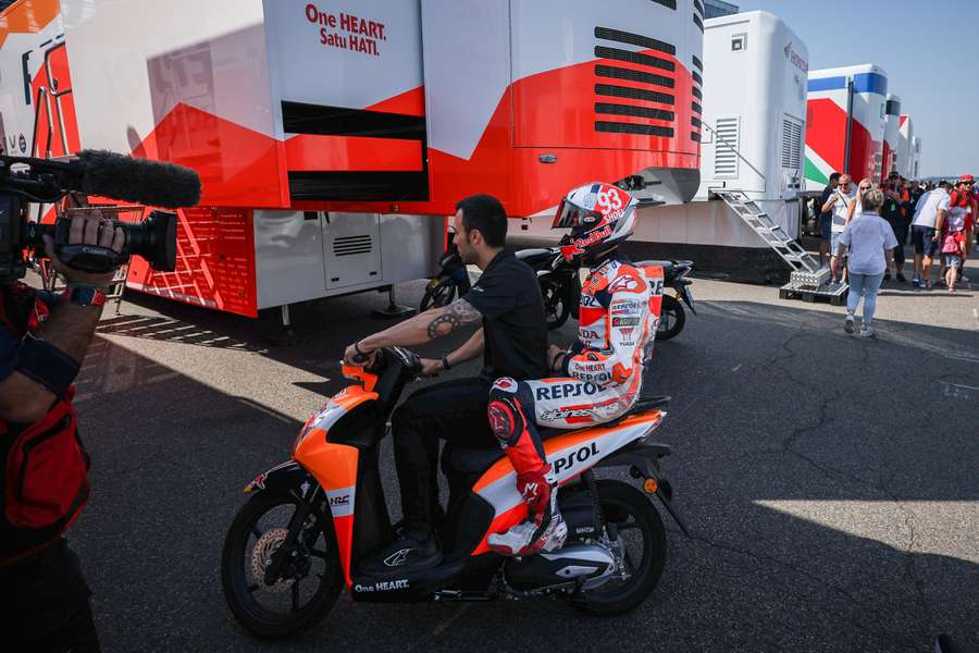 Marc Marquez riding back to the paddock after a crash during the warm-up prior to the German MotoGP