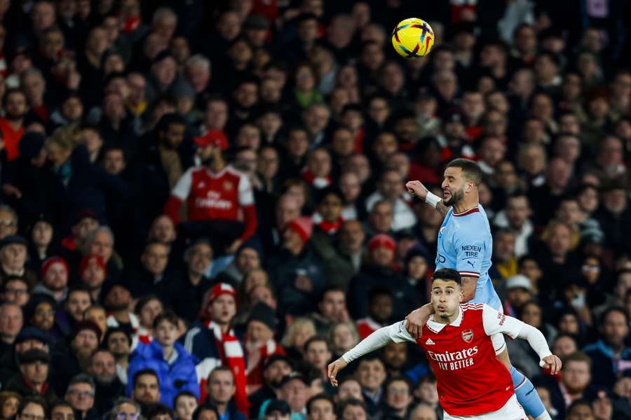 Arsenal's Brazilian midfielder Gabriel Martinelli fights for the ball with Manchester City's English defender Kyle Walker 