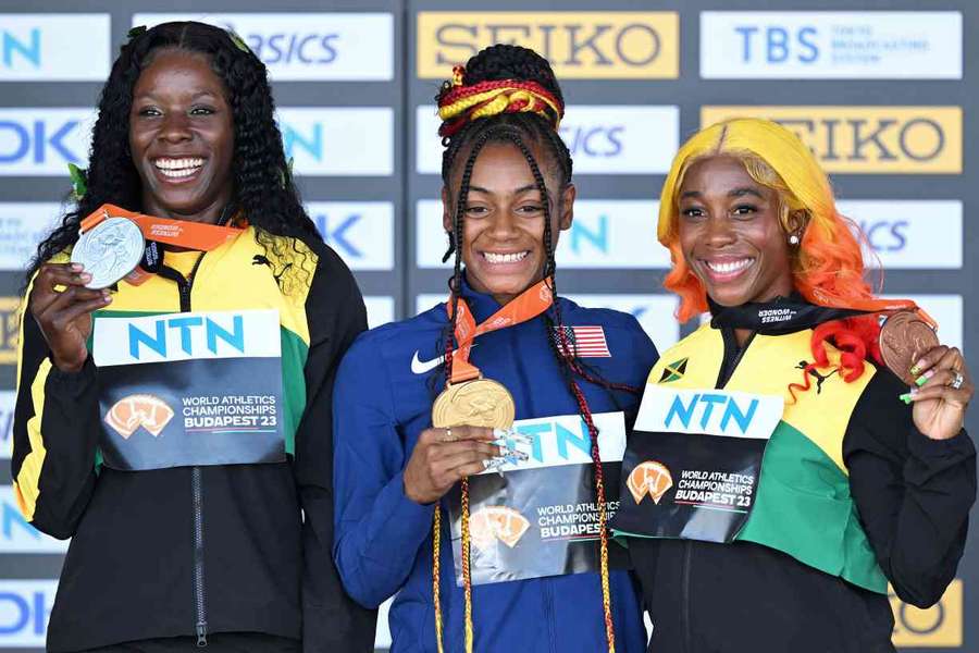 Jamaica's silver medallist Shericka Jackson, USA's gold medallist Sha'Carri Richardson and Jamaica's bronze medallist Shelly-Ann Fraser-Pryce pose during the podium ceremony for the women's 100m