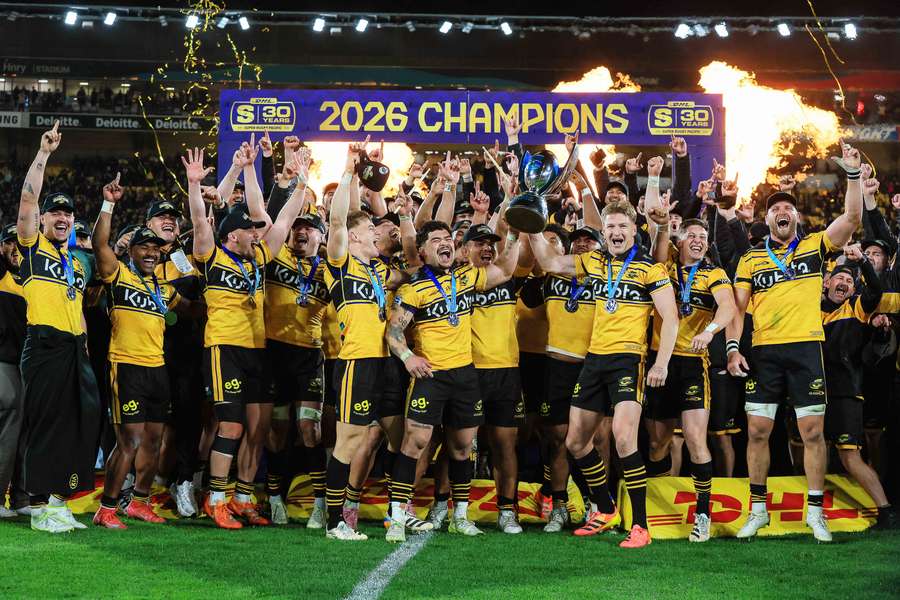 Hurricanes players celebrate their 2026 Super Rugby title.