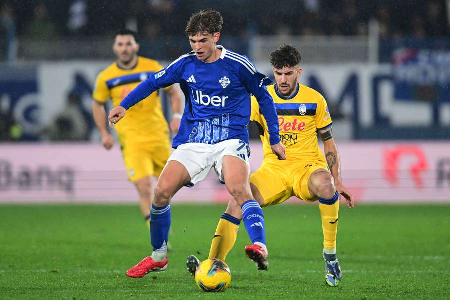 Ruggeri (right) battling for the ball against Como