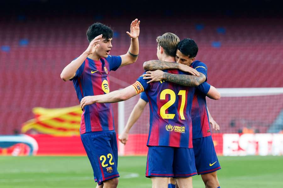 Marc Bernal, Frenkie de Jong and Joao Cancelo celebrate a Barcelona goal Marc Bernal, Frenkie de Jong and Joao Cancelo celebrate a Barcelona goal