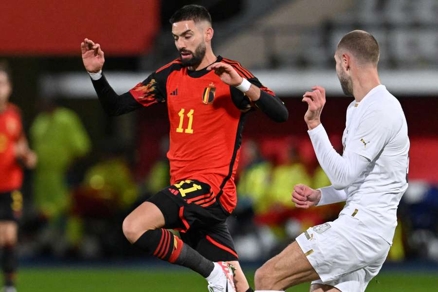 Belgium's Yannick Carrasco competes with Serbia's Strahinja Pavlovic for the ball