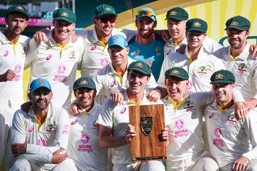 Australia pose with their trophy after the third Test against South Africa