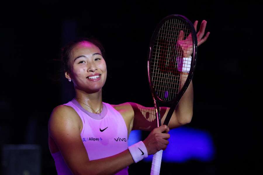 China's Qinwen Zheng celebrates after beating Kazakhstan's Elena Rybakina