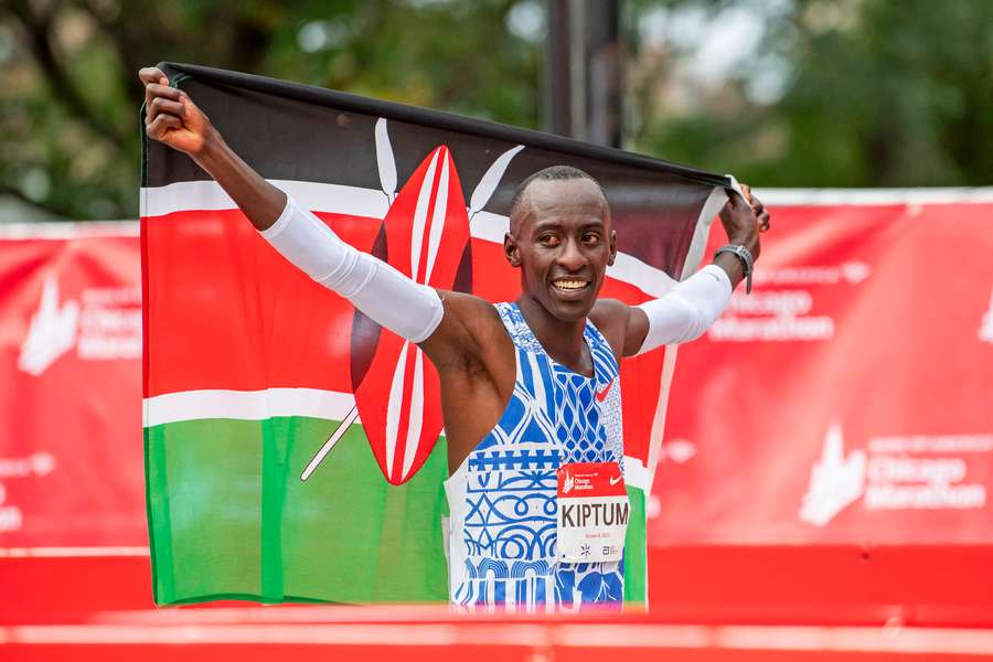 Kelvin Kiptum celebrates after finishing in a world record time of 2:00:35 to win the Chicago Marathon in 2023