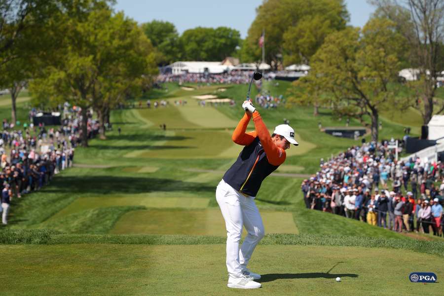 Viktor Hovland plays his shot from the 13th tee on the first day of the PGA Championship