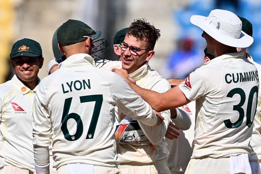 Australia's players celebrates with teammate Todd Murphy (C) 