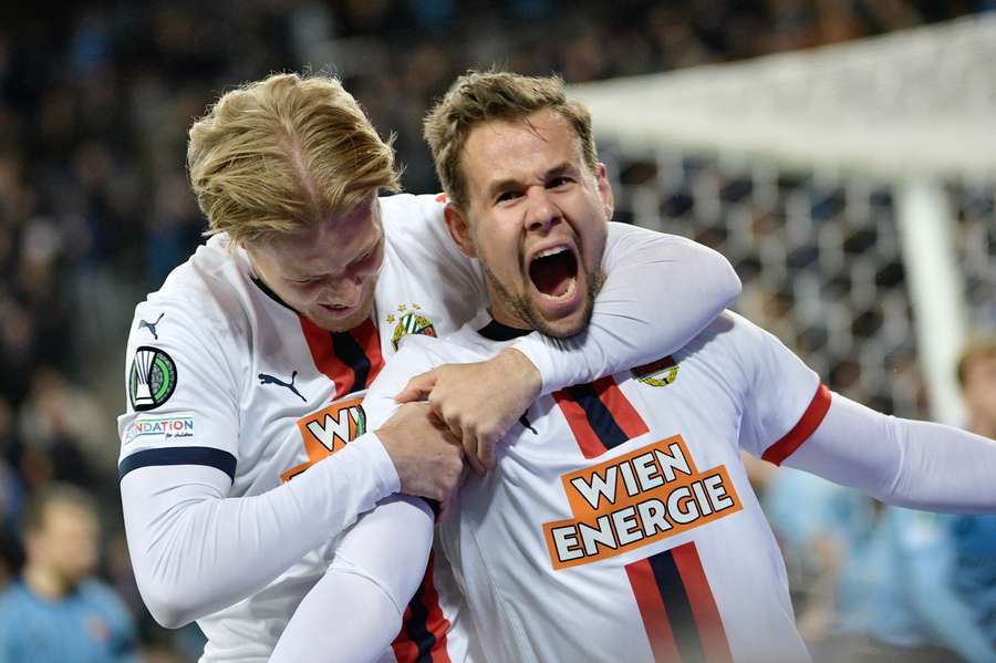 Noah Bischof (L) and Louis Schaub celebrate as Rapid take the lead against Djurgarden