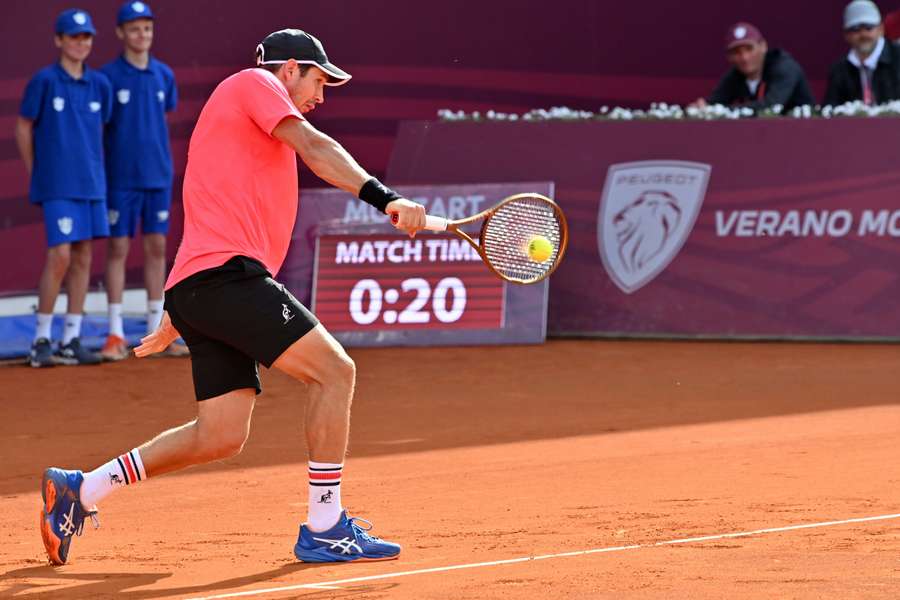 Serbia's Dusan Lajovic plays a backhand return to Serbia's Novak Djokovic