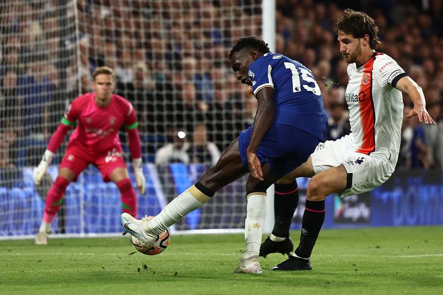 Jackson (L) fires a shot at the Luton goal