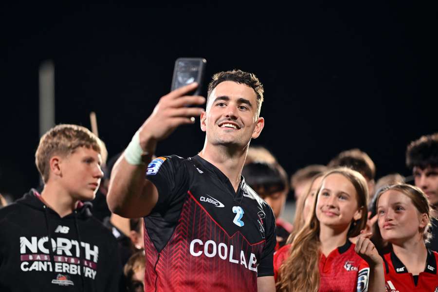 Will Jordan takes selfies with supporters during last weekend's home game.