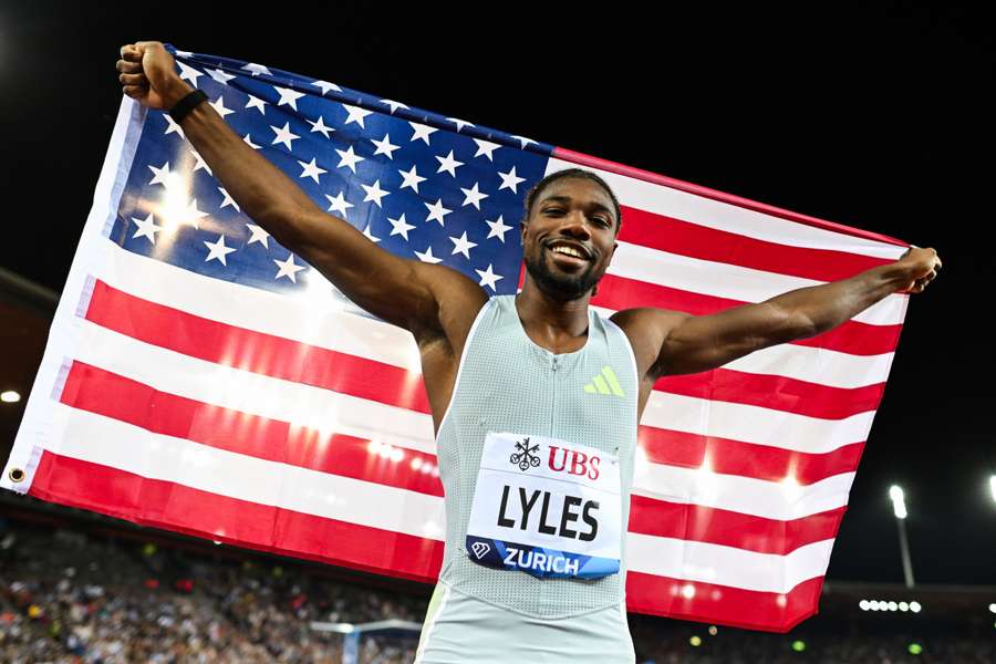 Noah Lyles celebrates after winning in the men's 200m final 