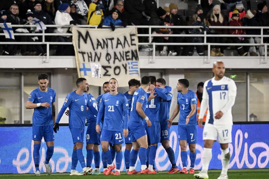 Greece's players celebrate Anastasios Bakasetas opening goal shortly after half-time