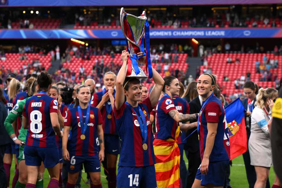 Aitana Bonmati of FC Barcelona celebrates with the UEFA Women's Champions League trophy in 2024