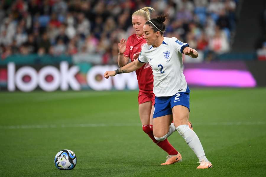 England's defender #02 Lucy Bronze (R) is challenged by Denmark's forward #17 Rikke Madsen