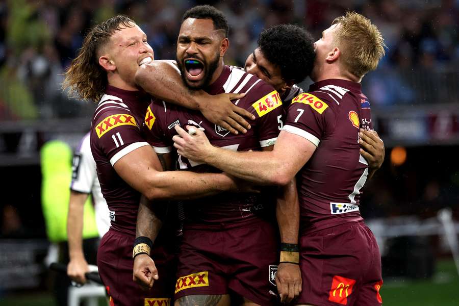 Maroons' Hamiso Tabuai-Fidow celebrates a try with teammates