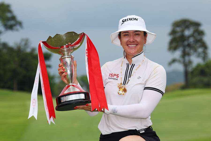 Hannah Green of Australia poses with the trophy