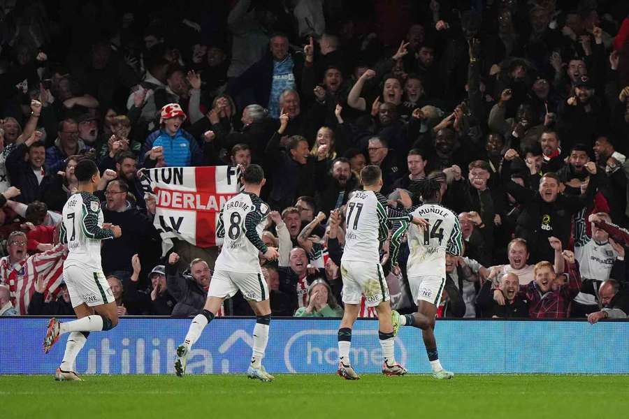 Sunderland's players celebrate in front of the away end