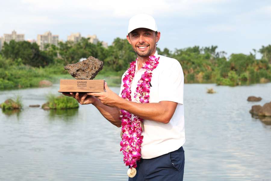 Marco Penge holds the Hainan Classic trophy