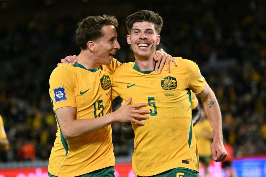 Australia’s Jordan Bos (R) celebrates with teammate Riley McGree