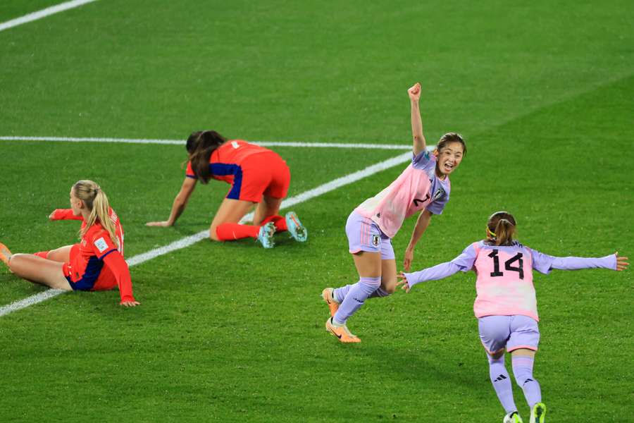 Japan's Risa Shimizu (C) celebrates against Norway