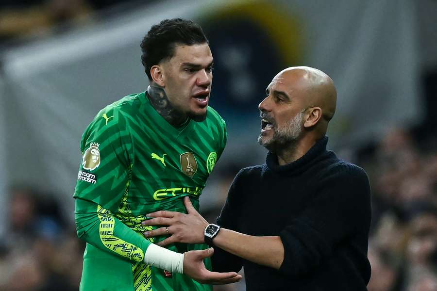 Manchester City goalkeeper Ederson argues with manager Pep Guardiola while being substituted during a 2-0 win over Tottenham Hotspur